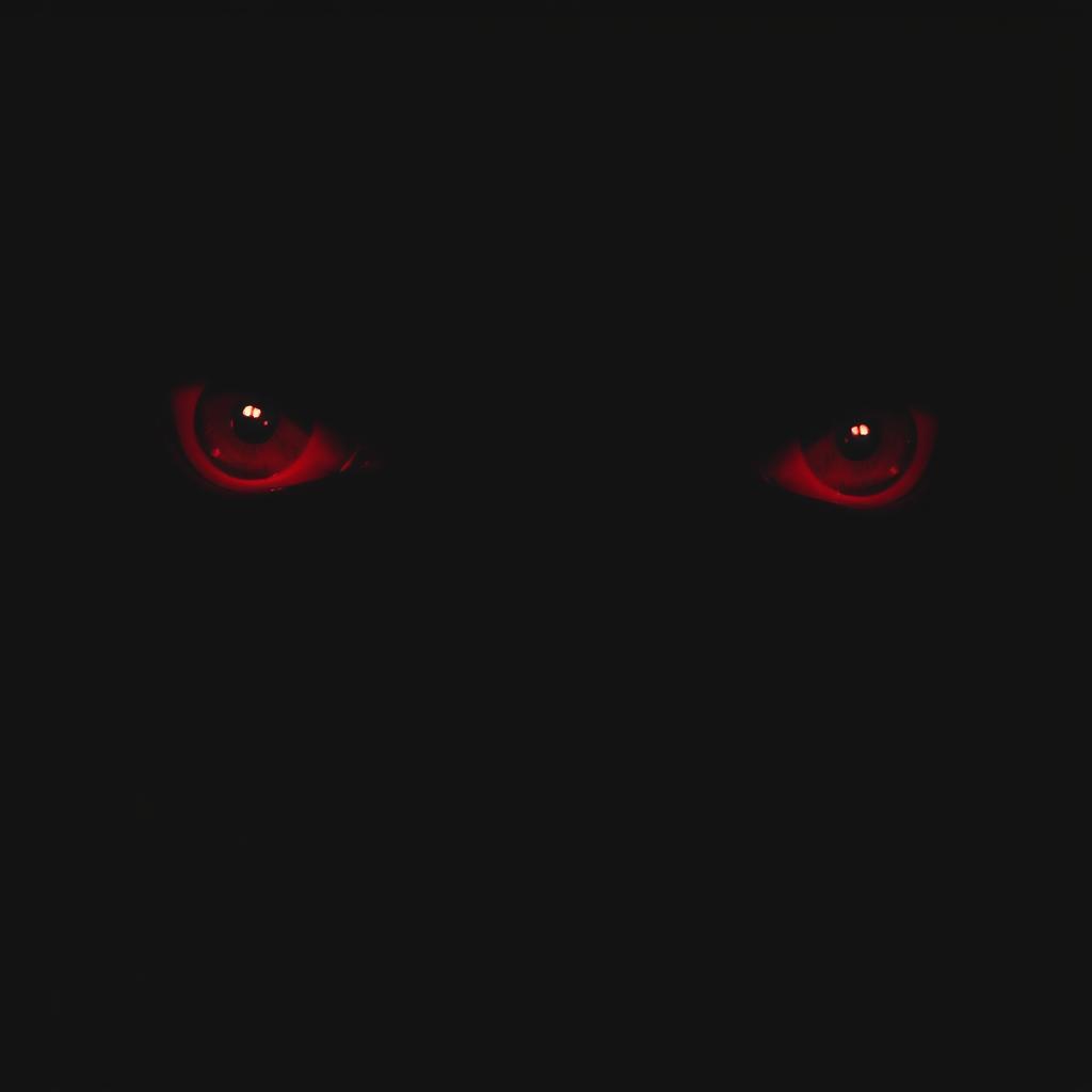 Mesmerizing Glowing Red Eyes in Darkness